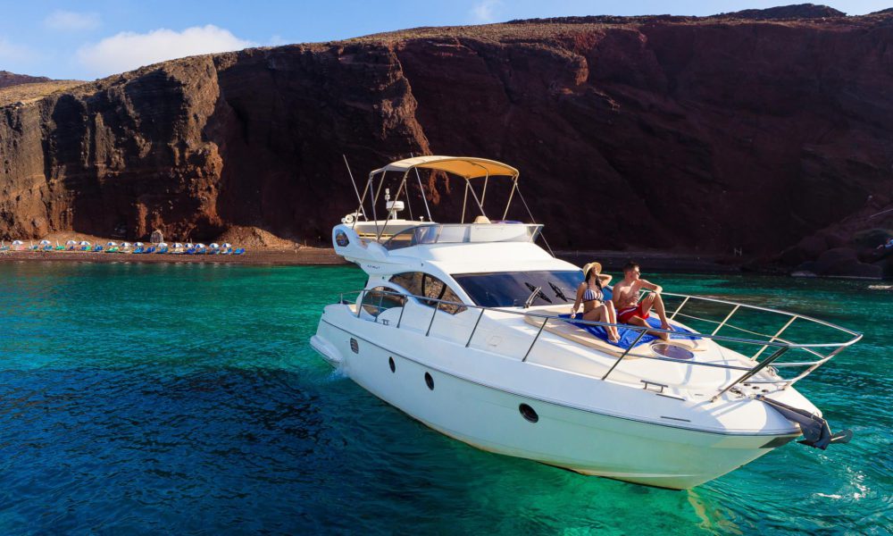 Couple aboard a Greek island sailing cruise on an Azimut vessel