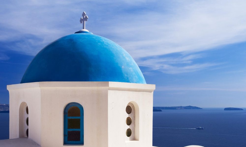 Explore the blue dome churches and festivals in Santorini.