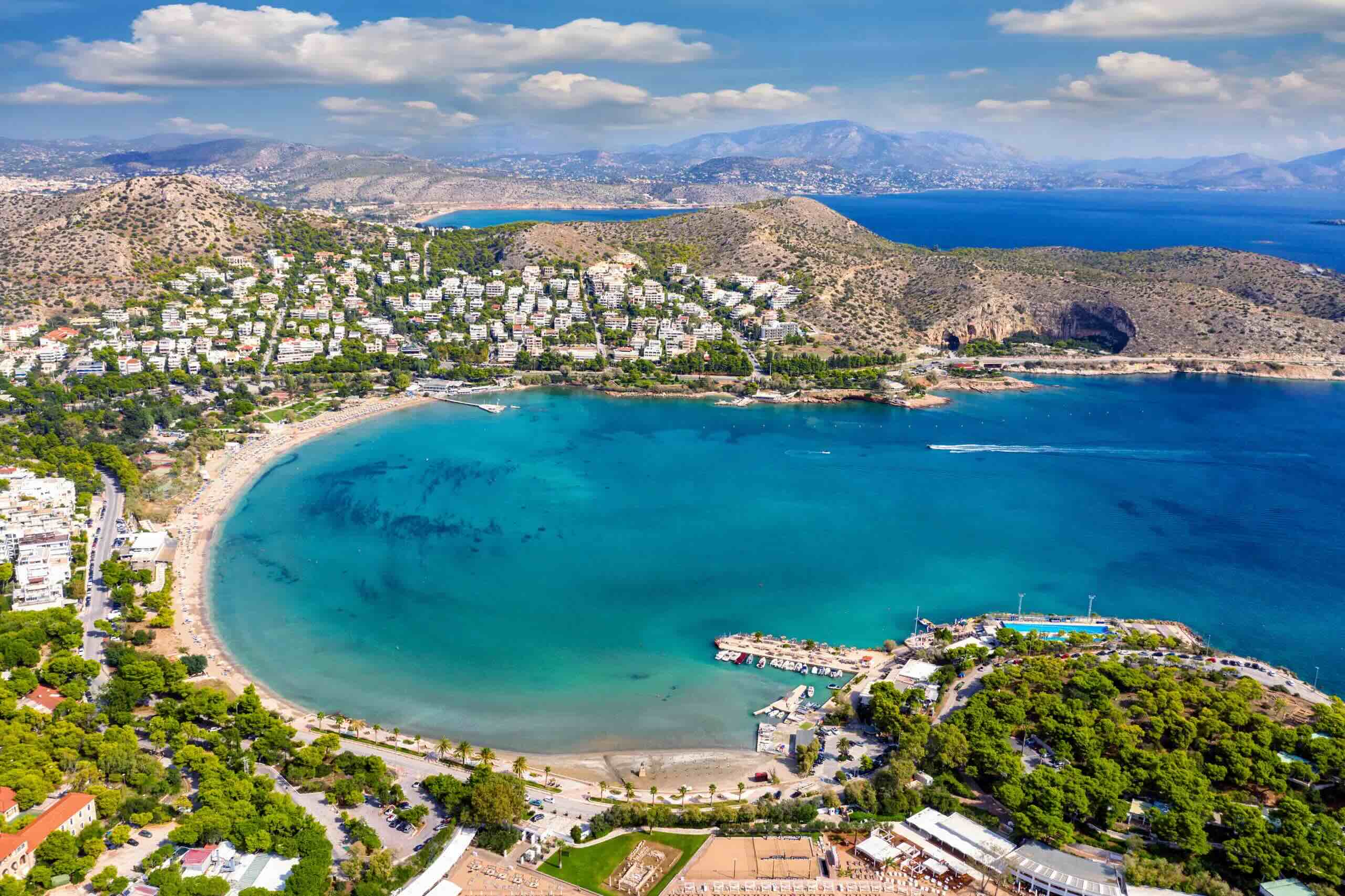 "Vouliagmeni's turquoise waters await! Join our daily catamaran cruises for pure sailing bliss. #VouliagmeniBay #SailingGreece"