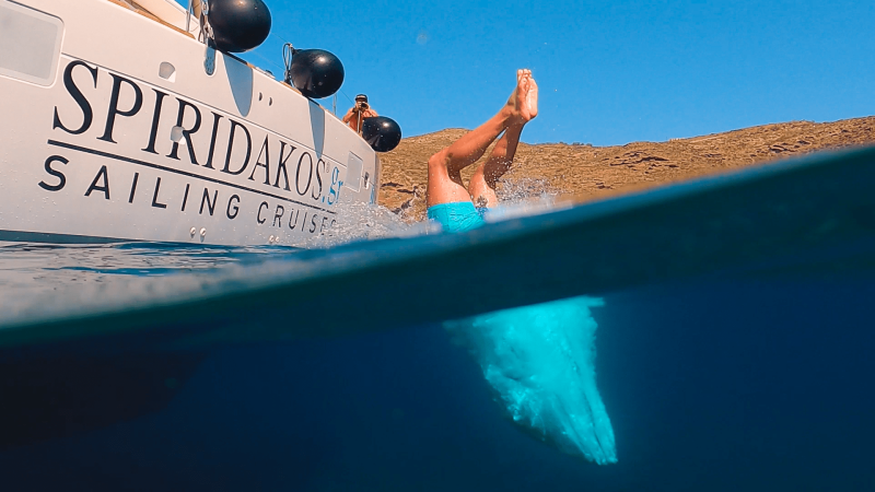 Diving into the crystal clear waters is one of the quintessential Santorini activities to do while on a sailing cruise.