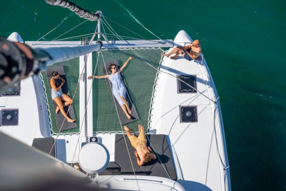 Enjoying the catamaran deck of Spiridakos Sailing Cruises, voted Best Experience in Greece 2026 by TripAdvisor. 