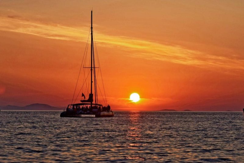 A sunset over sea is the main reason for choosing the best santorini sunset cruise by Spiridakos