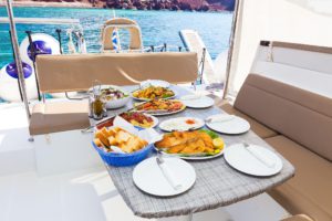 Greek buffet on board our best santorini sunset cruises with Spiridakos Sailing