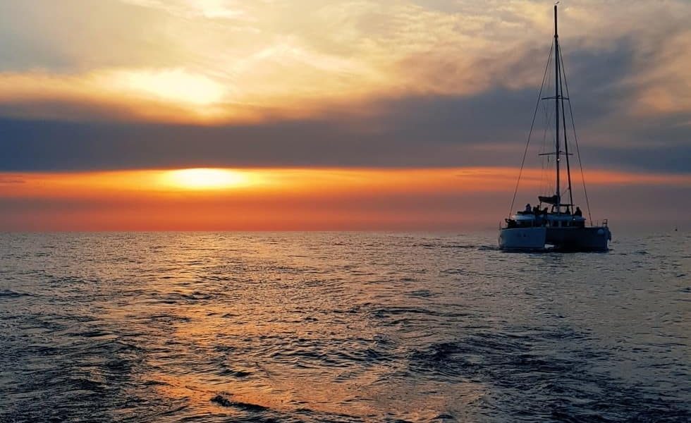 Amazing sunset at sea on board Spiridakos Sailing sunset dinner cruise santorini island