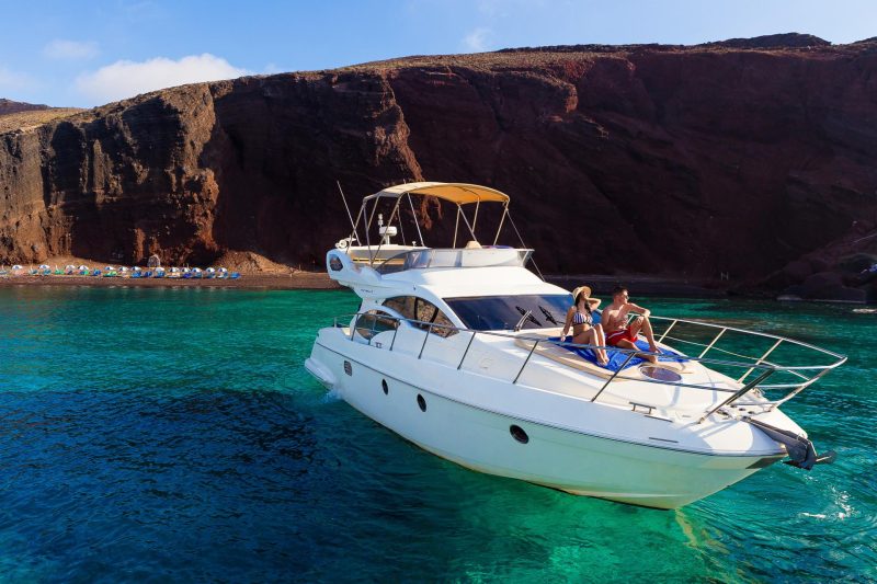Couple aboard a Greek island sailing cruise on an Azimut vessel